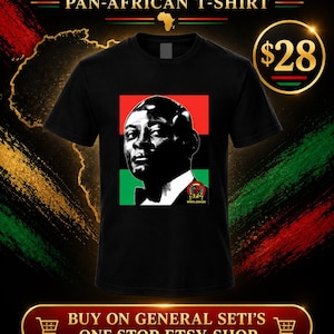 May include: A black short-sleeve t-shirt featuring a graphic print of a person in a suit and bowtie. The print is set against a background of red, black, and green horizontal stripes. A small circular logo with the text BPC WORLDWIDE is visible.
