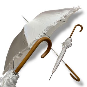 Classic 19th century style umbrella with long Malacca cane handle and shiny fabric, handcrafted by Ombrelli Domizio since 1989, Made in Italy