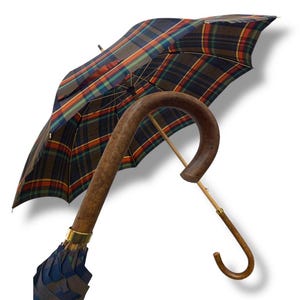 May include: A brown wooden walking stick umbrella with a plaid canopy in shades of blue, green, red, and brown.