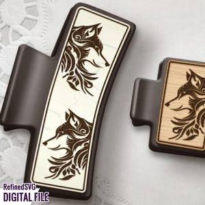 May include: Two wooden laser cut ornaments featuring a wolf head design with intricate floral details. The ornaments are on a white background.