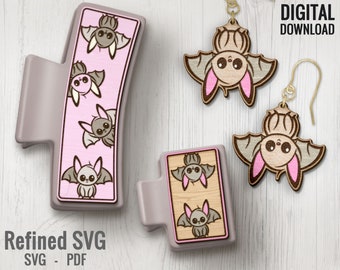 May include: A set of two pairs of wooden earrings featuring a cute cartoon bat design. The bats are brown with pink ears and are hanging upside down. The earrings are on a white wooden background. DIGITAL DOWNLOAD - SVG - PDF