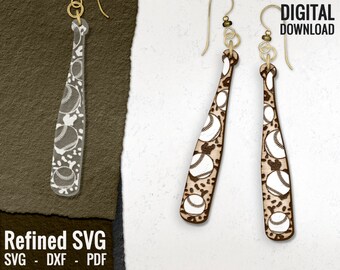 May include: Baseball bat-shaped earrings with baseball designs. The earrings are made of wood and feature a light brown color with white baseballs and a dark brown pattern. The earrings have gold-colored hooks and the text "DIGITAL DOWNLOAD".