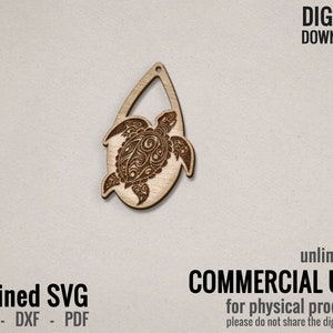 May include: A laser cut wooden cutout of a detailed turtle design. The turtle is in a teardrop shape with a hole at the top for hanging. The design is intricate and detailed, with a floral pattern on the turtle's shell.