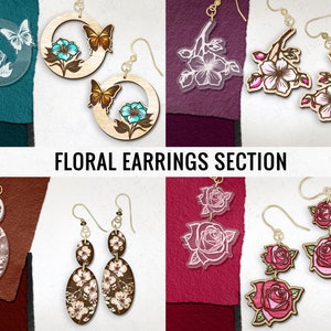 May include: Assortment of floral earrings featuring various designs, including butterflies, cherry blossoms, roses, and abstract floral patterns. The earrings are made of wood and have gold-tone metal findings. "Floral Earrings Section" is written in the center of the image.