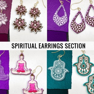May include: Assortment of spiritual earrings featuring various designs, including lotus flowers, geometric patterns, hamsa hands, and yoga figures. The earrings are made of wood and acrylic and come in a variety of colors, including purple, pink, brown, teal, and white.