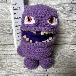 Quirky Purple Monster with Human-like Teeth