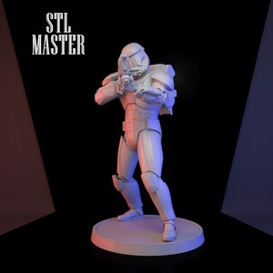 May include: A white 3D printed figurine of a Star Wars clone trooper holding a blaster rifle. The figurine is standing on a round base. The text "STL MASTER" is visible in the background.
