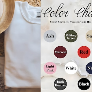 May include: Color chart for unisex crewneck sweatshirts and hoodies. The chart shows 10 different colors: Ash, Military Green, Sand, Maroon, Red, Light Pink, White, Navy, Dark Heather, and Black.