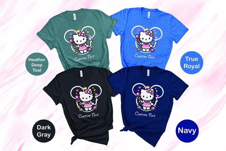 May include: Four t-shirts in different colors with a cartoon image of a pink Hello Kitty character wearing a crown and holding a wand. The text "CUSTOM TEXT" is printed on each shirt.