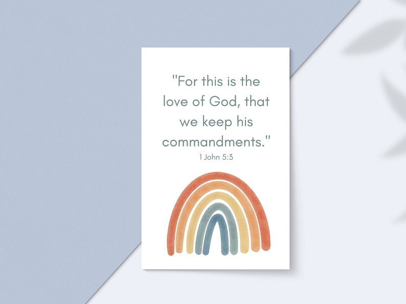 May include: A white card with a rainbow illustration and the text "For this is the love of God, that we keep his commandments." 1 John 5:3