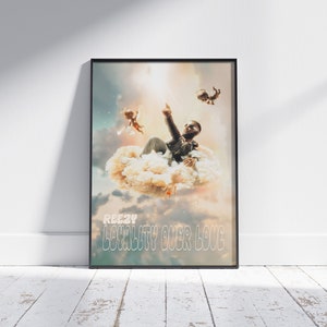 May include: A poster with a colorful, abstract background featuring a man sitting on a cloud with two cherubs flying above him. The text "REEZY LOYALTY OVER LOVE" is printed at the bottom of the poster.