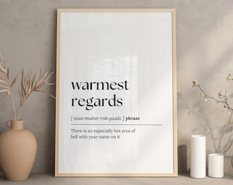 May include: A framed print with the words "warmest regards" in a bold, black font. Below the phrase is a phonetic pronunciation and a humorous definition. The print is displayed in a neutral-toned room.