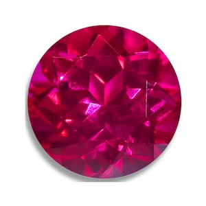 May include: A close-up of a round, faceted ruby gemstone. The ruby is a deep red color and has a high level of brilliance.