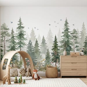 May include: A nursery room with a forest-themed mural featuring watercolor-style evergreen trees and flying birds. A wooden play tent, a dresser, a woven basket, and a white rug are in the room. Stuffed animals and wooden toys are arranged on the rug.