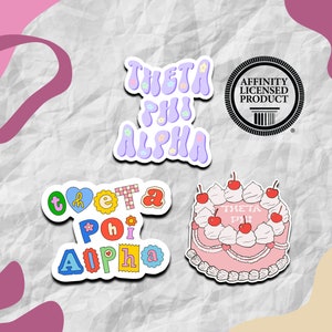 May include: A collection of stickers featuring the Greek letters Theta Phi Alpha. Designs include the sorority's name in a bubble font, a cake with cherries, and a circular seal. The stickers are in pastel colors.