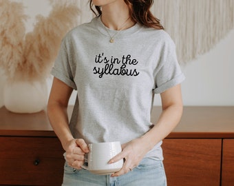 It's in the Syllabus T-Shirt, Funny Teacher Shirt, TA Tee, Back to School Gift