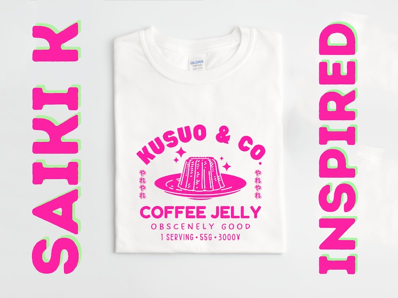 May include: White t-shirt with a pink graphic design featuring a plate of coffee jelly with the text "Kusuo & Co. Coffee Jelly Obscenely Good 1 Serving - 556 - 3000V" in pink.