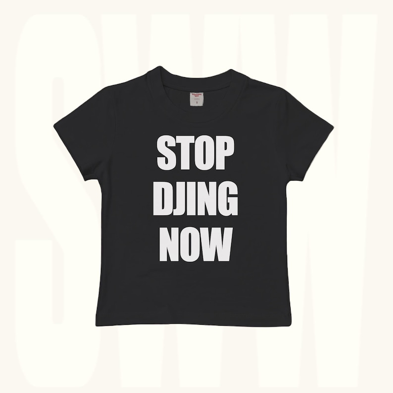 Black baby tee with white STOP DJING NOW funny rave slogan