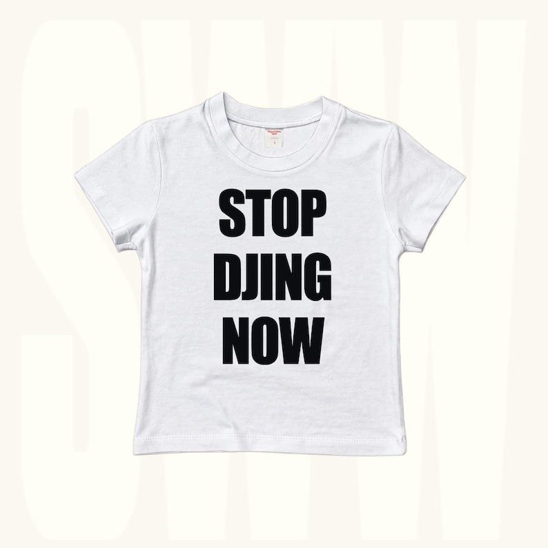 White baby tee with bold STOP DJING NOW slogan print