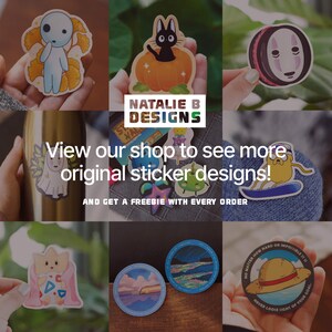 May include: Assortment of colorful stickers featuring various characters and designs. Stickers include a ghost, a black cat in a pumpkin, a No Face character from Spirited Away, a cartoon dog, a pink creature, a landscape, and a straw hat with a quote. The text on the sticker reads "No matter how hard or impossible it is, never lose sight of your goal."