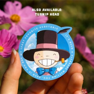 May include: A blue and white sticker with a cartoon character wearing a black top hat and a blue bow tie. The text on the sticker reads "You are my least favorite vegetable. It's been a pleasure meeting you, even if..." and "Also available: Turnip Head".