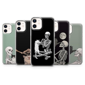May include: A collection of phone cases featuring skeleton illustrations interacting with cats. The cases have a variety of backgrounds, including black and green. The skeleton designs are detailed and artistic, with a spooky, yet playful theme.