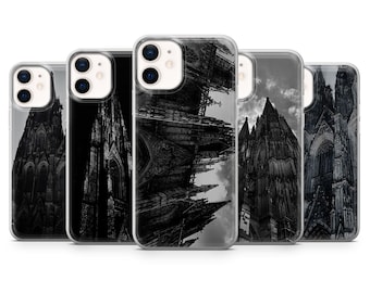 May include: A collection of five phone cases featuring a black and white image of a cathedral. The cases are made of clear plastic and showcase different angles of the architectural structure. The cathedral's intricate details are visible.