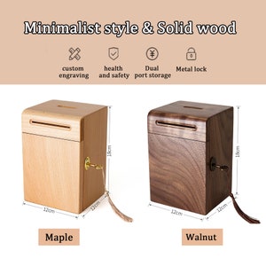Peut inclure: Deux bo&icirc;tes &agrave; monnaie en bois avec une fente sur le dessus et un trou de serrure sur le c&ocirc;t&eacute;. La bo&icirc;te de gauche est en bois d'&eacute;rable et est de couleur brun clair. La bo&icirc;te de droite est en bois de noyer et est de couleur brun fonc&eacute;. Les deux bo&icirc;tes mesurent 12 cm de large et 18 cm de haut.