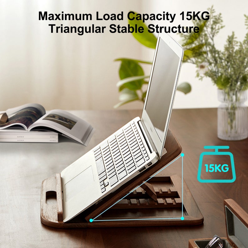 May include: A wooden laptop stand with a triangular design. The stand is made of dark wood and has a handle on the side. A laptop is placed on the stand, and the stand is angled to provide a comfortable viewing angle. The stand is labelled with a maximum load capacity of 15KG.