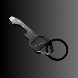 Porte-clés de poche avec ouvre-bouteille, tournevis, règle, clé, cutter, dent de scie - Noir OU - Finition argentée - Multifonctionnel 6 en 1