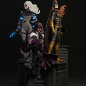 May include: A detailed sculpture featuring three female superhero figures. The figures are in dynamic poses, with one holding a glowing blue baton. The color palette includes gray, black, purple, and gold, with a dark background.
