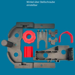 Pode incluir: Um suporte de c&acirc;mera ajust&aacute;vel de pl&aacute;stico preto com uma manivela vermelha e uma pe&ccedil;a de pl&aacute;stico vermelha. O texto "Winkel &uuml;ber Stellschraube einstellbar" &eacute; vis&iacute;vel na imagem.