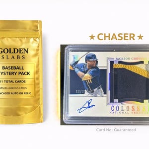 May include: A gold-colored pouch labeled GOLDEN SLABS BASEBALL MYSTERY PACK with 11 total cards, alongside a clear plastic encased Jackson Chourio baseball card featuring a blue autograph and a dark blue and yellow fabric relic patch.