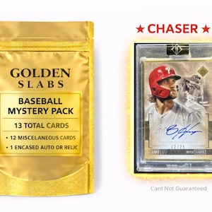 May include: A golden foil baseball mystery pack with the text "GOLDEN SLABS BASEBALL MYSTERY PACK" and a baseball card in a protective case. The card features a player in a red helmet and the text "CHASER".