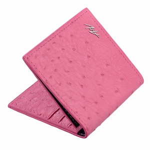 May include: A bright pink bifold wallet featuring a textured ostrich-style pattern. The exterior displays a silver metallic logo with the letters A and V in a cursive script. The wallet is partially open, revealing internal card slots.