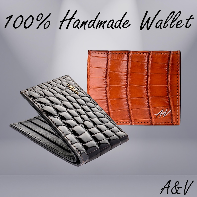 May include: Two leather wallets, one black and one brown, with a crocodile pattern. The wallets are 100% handmade and feature the initials "A&V" on the brown wallet.