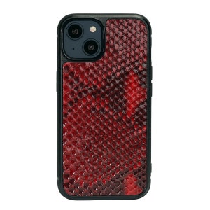May include: A red snakeskin phone case with a black frame and a camera cutout.
