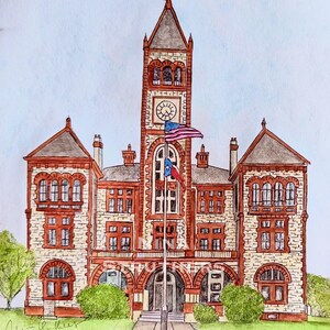 May include: A watercolour and ink illustration of a multi-storey stone building with a central clock tower, arched windows, and red brick trim. Two flags, the American flag and the Texas flag, fly on a pole in front of the building entrance.