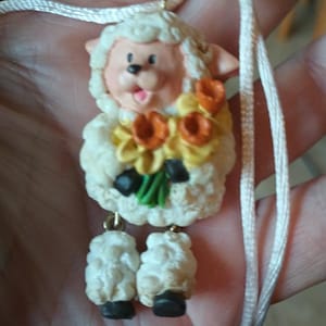 ADORABLE Easter/Springtime lamb with dangling legs, springtime bouquet, necklace, highly detailed,