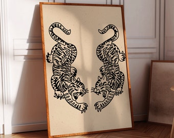 May include: A framed art print featuring two black tiger illustrations facing each other. The tigers have detailed stripes and are set against a beige background. The frame is a warm brown color, and the artwork is displayed in a room with wooden floors.