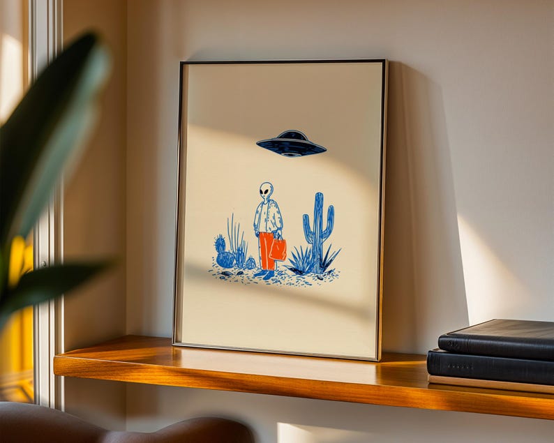 Retro alien UFO wall art featuring a quirky extraterrestrial walking through a desert landscape with cactus plants under a hovering spaceship. Bold blue and orange accents add a playful modern touch to the minimalist sci-fi illustration. Perfect for game rooms, living rooms, or offices, this unique artwork brings humor, character, and a creative sci-fi vibe to any interior. Ideal for space lovers and geek decor.
