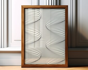 May include: A framed artwork with a minimalist design. The wooden frame surrounds a print featuring black, wavy lines on a cream-colored background. The artwork is leaning against a white wall and rests on a wooden floor.