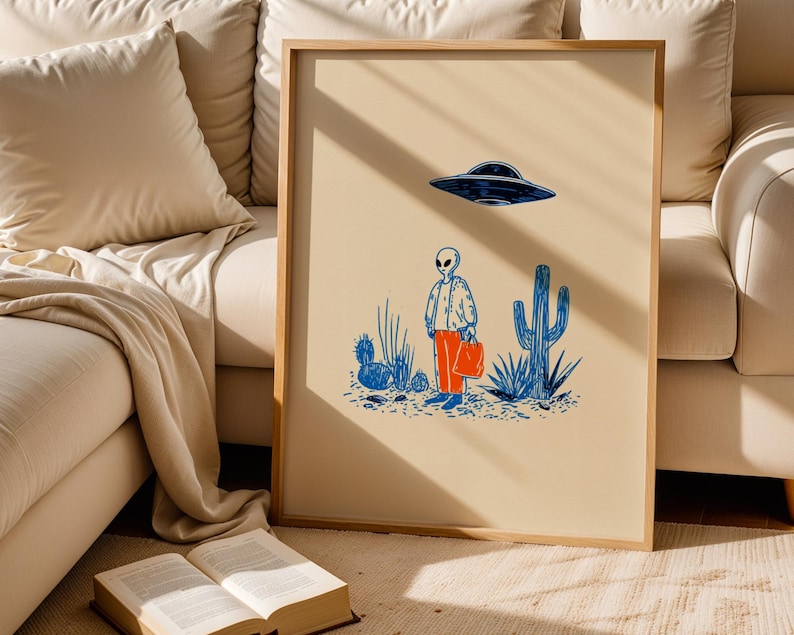 Retro alien UFO wall art featuring a quirky extraterrestrial walking through a desert landscape with cactus plants under a hovering spaceship. Bold blue and orange accents add a playful modern touch to the minimalist sci-fi illustration. Perfect for game rooms, living rooms, or offices, this unique artwork brings humor, character, and a creative sci-fi vibe to any interior. Ideal for space lovers and geek decor.