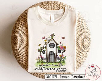 Puede incluir: Una camiseta blanca con un diseño de una iglesia con flores y el texto "consider how the wildflowers grow... LUKE 12:27".