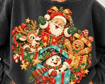 May include: A charcoal gray crewneck sweatshirt featuring a festive graphic print of Santa Claus, a reindeer, a gingerbread man, and a snowman, each emerging from colorful gift boxes decorated with ribbons, bows, stars, and holly leaves.