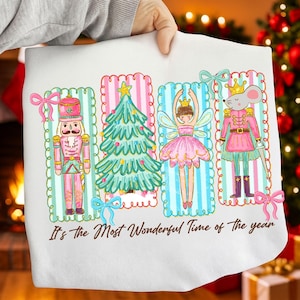 May include: White Christmas-themed pillowcase featuring a nutcracker, Christmas tree, fairy, and mouse soldier illustrations. The design includes pink and blue accents, with the text "It's the Most Wonderful Time of the Year."