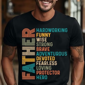 May include: Black t-shirt with the word "FATHER" in a retro design, with a list of positive attributes in various colors. The attributes include "Hardworking", "Funny", "Wise", "Strong", "Brave", "Adventurous", "Devoted", "Fearless", "Loving", "Protector", and "Hero".
