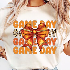 Orange Coquette Bow Game Day Png, Coquette Football Png, Touch Down Seson Png, Cheer Football Png, Sports Coquette Bow Png , Game Day Shirt