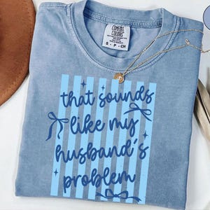 May include: A rustic wooden sign with the text "Welcome to our home" in white lettering. The sign features a distressed finish and a simple, inviting design, perfect for entryway decor.
