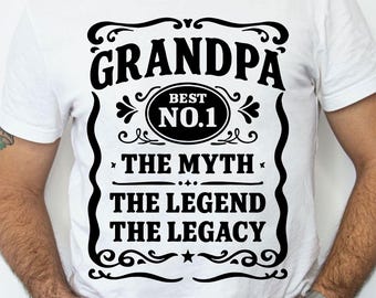 May include: White t-shirt with a black graphic design that says "Grandpa Best No.1 The Myth The Legend The Legacy".